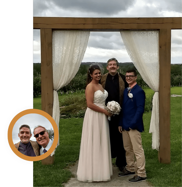 Bride and groom with officiant outdoors